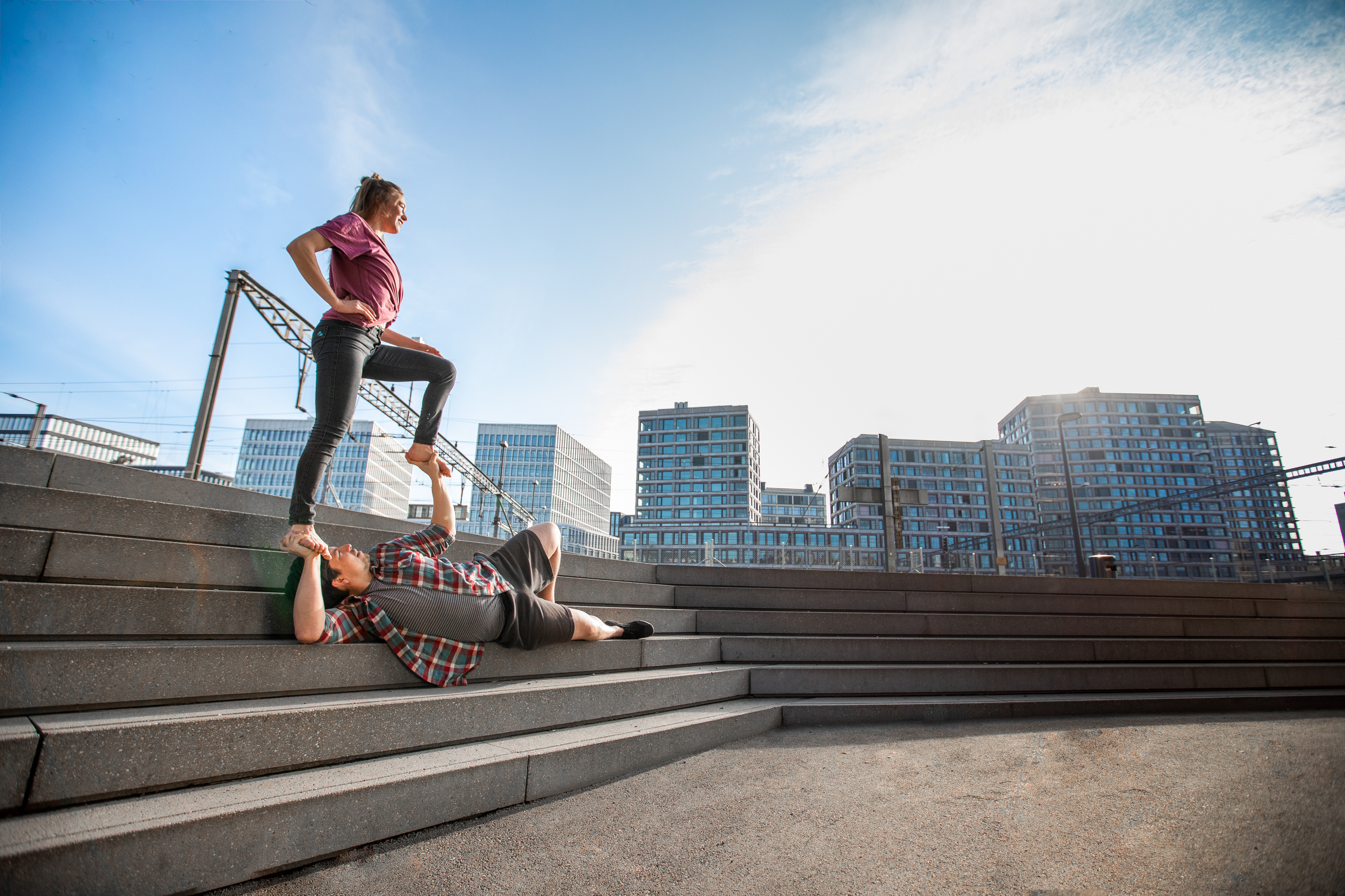 urban acro yoga pose of acroyoga in the event Inputs to Foot to Hand and Flows
