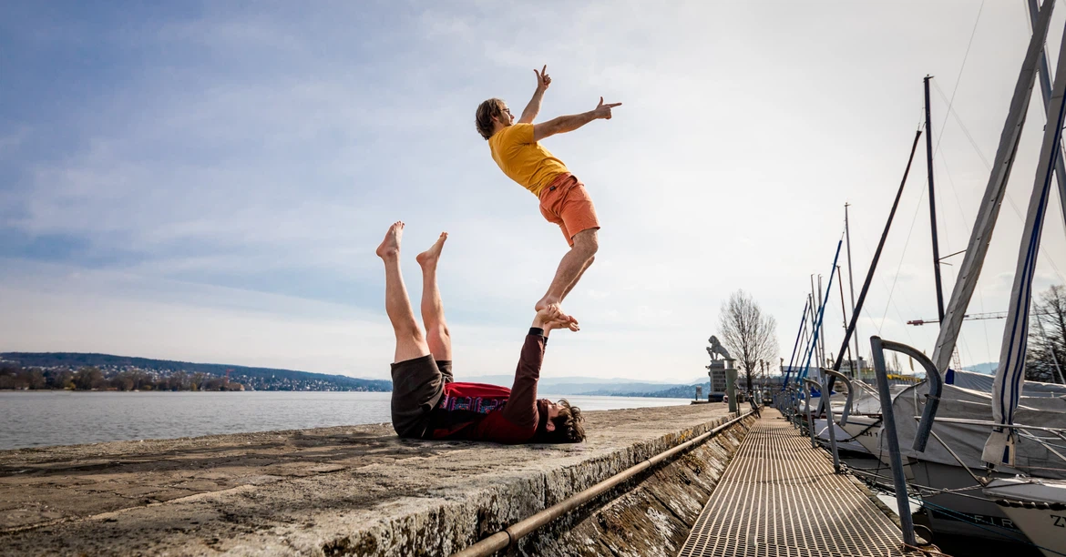 urban acro yoga pose of acroyoga in the event Find the Balance