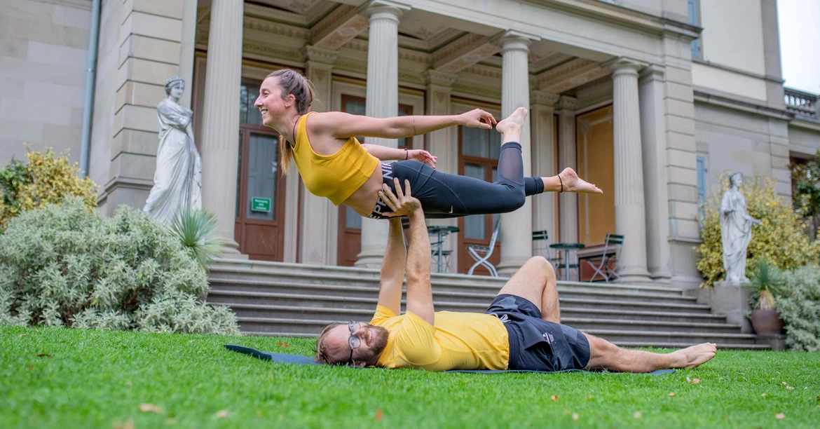 urban acro yoga pose of acroyoga in the event Learn transitions and flows